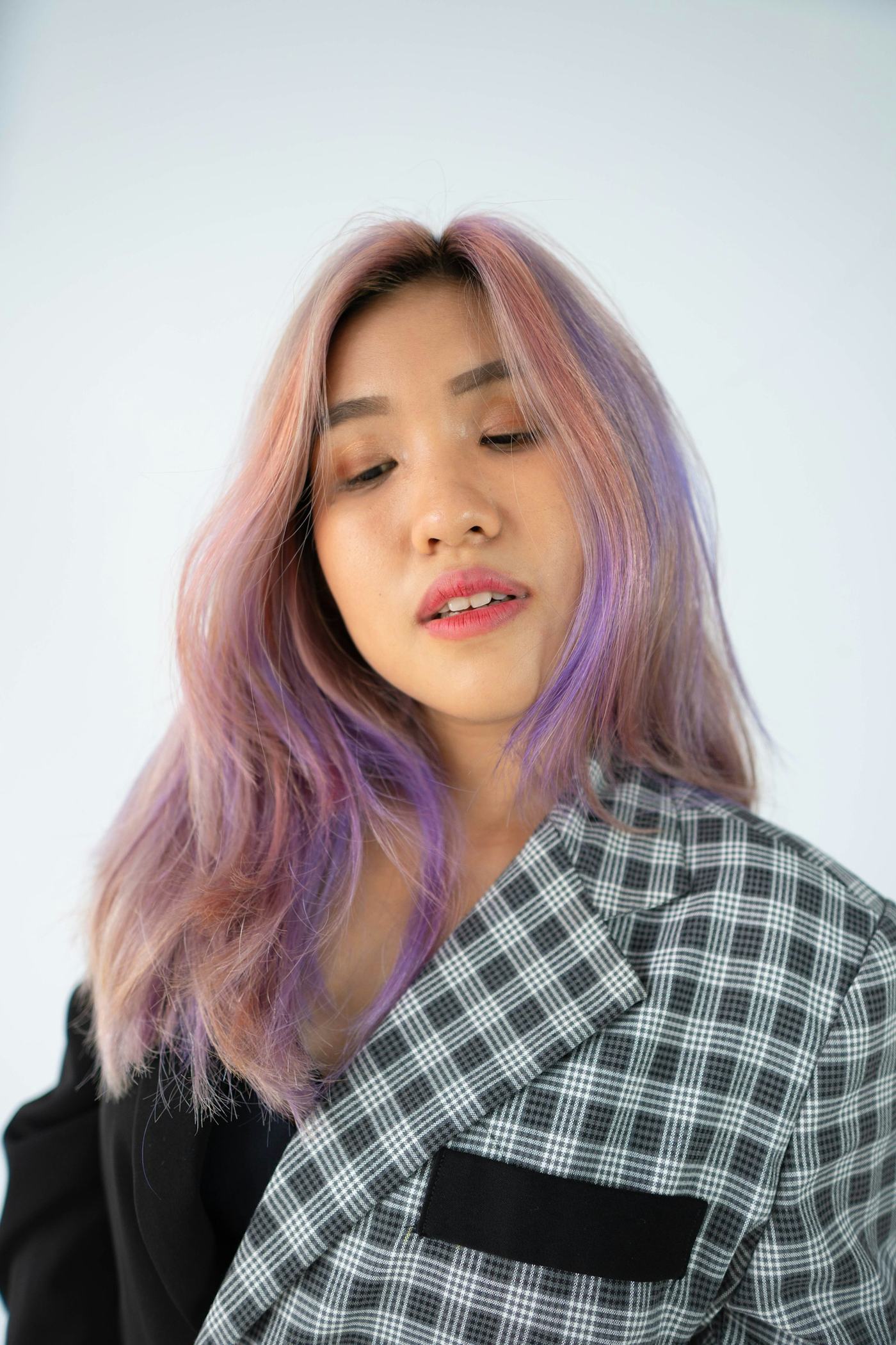 Faded pastel pink hair, which needs a pink colour-depositing shampoo rather than purple shampoo